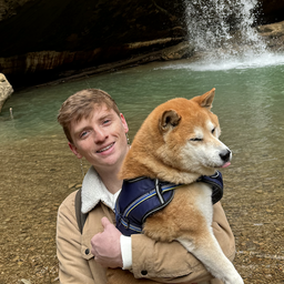 Sam and Niko in front of a waterfall